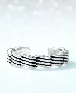 Detailed close-up of S925 sterling silver ring with vintage woven texture and oxidized finish