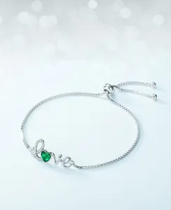 Detailed close-up of S925 silver Love bracelet with a heart-shaped lab emerald stone