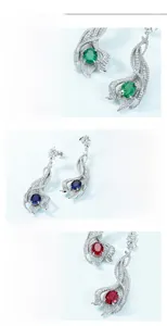 Close-up of S925 silver vintage hollow leaf drop earrings with colorful gemstones