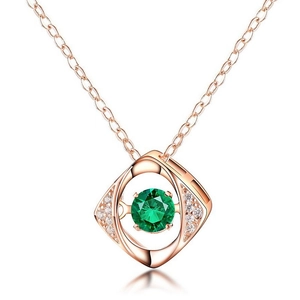 Rose gold Dancing Devil Eye necklace featuring a green emerald and sparkling cubic zirconia