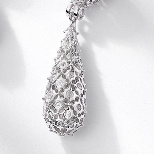 Elegant S925 silver teardrop earrings with hollow pavé zircon stones in a classic design
