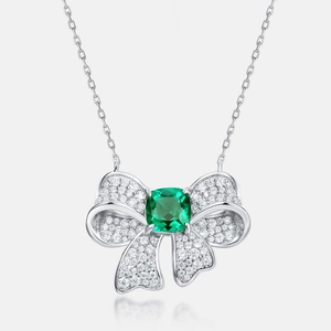 Luxurious butterfly pendant necklace with cushion-cut emerald and pave-set diamonds