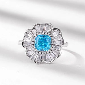 Luxury S925 silver flower ring with square blue gemstone and radiant zircon petals