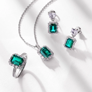Luxury S925 silver jewelry set with emerald-cut green gemstones and sparkling accents