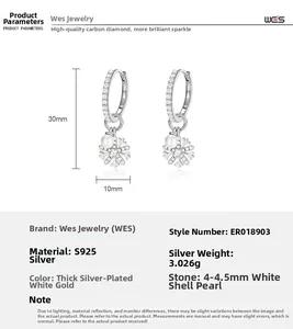 Detailed view of S925 silver snowflake earrings with shell beads and high carbon diamonds