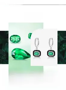 Detail of S925 silver earring with emerald cut green stone and black enamel frame