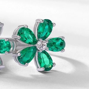 Elegant S925 silver ring featuring emerald petals in a vintage floral cluster design