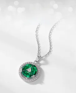 Macro detail of S925 silver necklace with marquise lab emerald and halo cubic zirconia