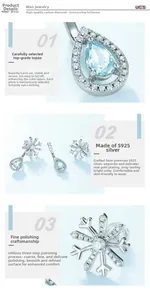 Macro shot of S925 silver snowflake earrings with sky blue topaz drop gems and fine detail
