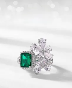 Macro detail of petal-shaped ring featuring emerald-cut lab stone and pavé setting