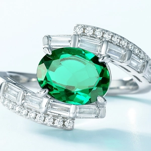 Oval emerald gemstone ring in S925 sterling silver with baguette and round diamond accents