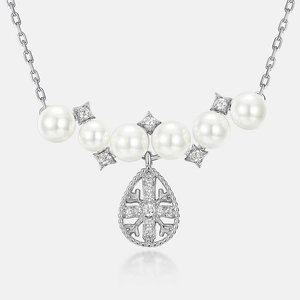 S925 silver necklace with white pearls and snowflake cross pendant featuring teardrop design