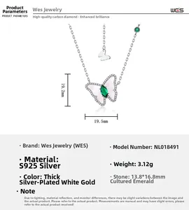 Detail of S925 silver butterfly necklace with green lab emerald and white shell wings
