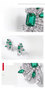 Macro shot of S925 silver earring with emerald-cut green stone and zircon inlay