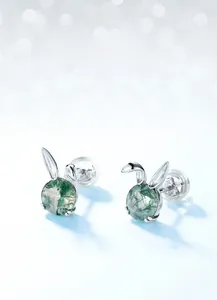 Detailed macro view of S925 silver bunny earrings with translucent moss agate gemstone
