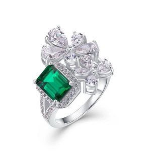 Floral S925 silver ring with emerald-cut green gemstone and teardrop zircon accents