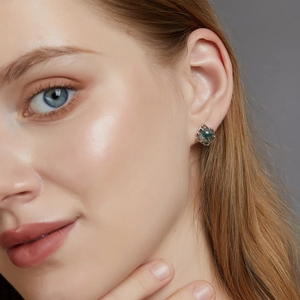 Unique S925 silver stud earrings featuring round green moss agate with natural texture