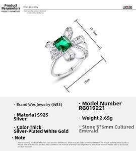 Detail of S925 silver ring with 6x6mm lab emerald and bow-shaped sparkling zircon stones