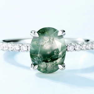Oval moss agate ring with S925 silver four-prong setting and side accent stones