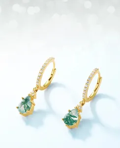 Detail of teardrop moss agate earrings with gold hoop and small diamond accents