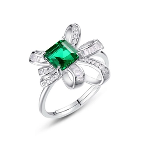 Luxurious S925 silver ring featuring emerald cut stone and bow-knot pavé setting