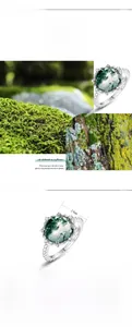 Macro detail of natural 10x10mm moss agate stone set in a polished S925 silver ring