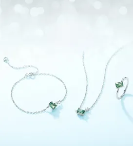 Detailed close-up of S925 silver jewelry set with green moss agate rectangular stones