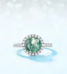 Close-up of S925 silver ring with natural moss agate stone and sparkling zirconia pavé