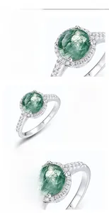 Macro shot of S925 silver ring featuring round green moss agate and inlaid cubic zirconia