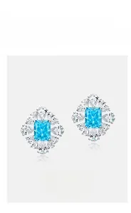 Detail of S925 silver flower stud earrings with ice cut blue gem and teardrop stones