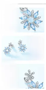 Macro detail of snowflake stud earrings featuring S925 silver and blue cubic zirconia