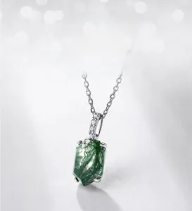 Macro detail of hexagonal green moss agate pendant with S925 silver and zircon setting