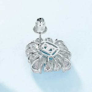 S925 silver flower stud earrings with blue gemstone and multi-prong setting back view