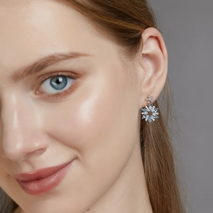 Elegant S925 silver snowflake earrings with marquise light blue gemstones and diamonds
