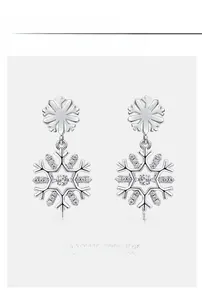 Detailed close-up of S925 sterling silver snowflake earrings with cubic zirconia inlay
