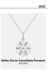 Close-up of sparkling S925 silver snowflake pendant with white cubic zirconia crystals