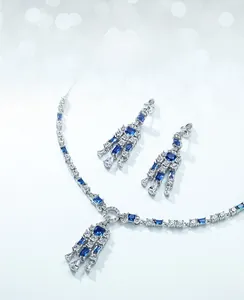Detail of S925 silver necklace with blue spinel pendant and sparkling white stones