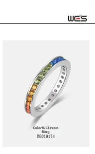 Macro shot of S925 silver ring featuring a gradient row of multi-color cubic zirconia stones