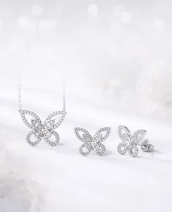 Detailed view of S925 silver butterfly necklace and stud earrings set with micro-pave crystals