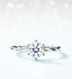 Macro detail of vine-inspired ring with 1ct moissanite and classic six-prong setting