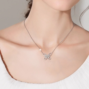 Elegant S925 sterling silver butterfly necklace featuring sparkling pave-set zircons on model