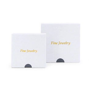 Two-piece white book-style jewelry boxes with gold Fine Jewelry print and drawer notch