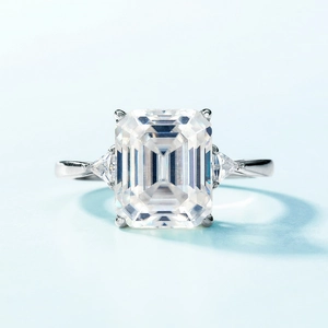 Three-stone S925 silver ring featuring emerald cut center stone and triangular side gems