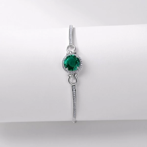 Elegante pulsera de plata S925 con una gran esmeralda redonda y halo de diamantes