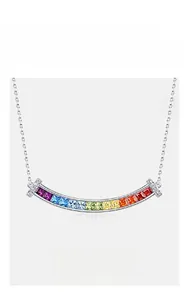 Detailed macro view of rainbow zircon pendant necklace on a delicate silver chain