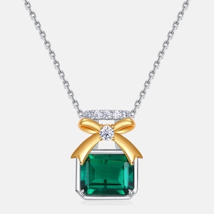 S925 silver necklace featuring a rectangular emerald pendant with a gold bow detail