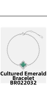 Detail of lab-grown emerald four-leaf clover bracelet in S925 silver with small diamonds