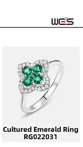 Macro shot of S925 silver four-leaf clover ring with lab-grown emeralds and diamonds