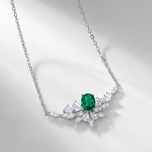Luxurious S925 silver emerald pendant necklace with radiant zircon in a floral sunburst design
