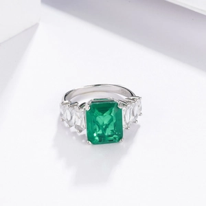 Luxurious S925 sterling silver ring with emerald-cut green stone and side accents